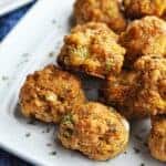 Sausage balls on a white plate ready to eat.