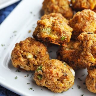 Sausage balls on a white plate ready to eat.