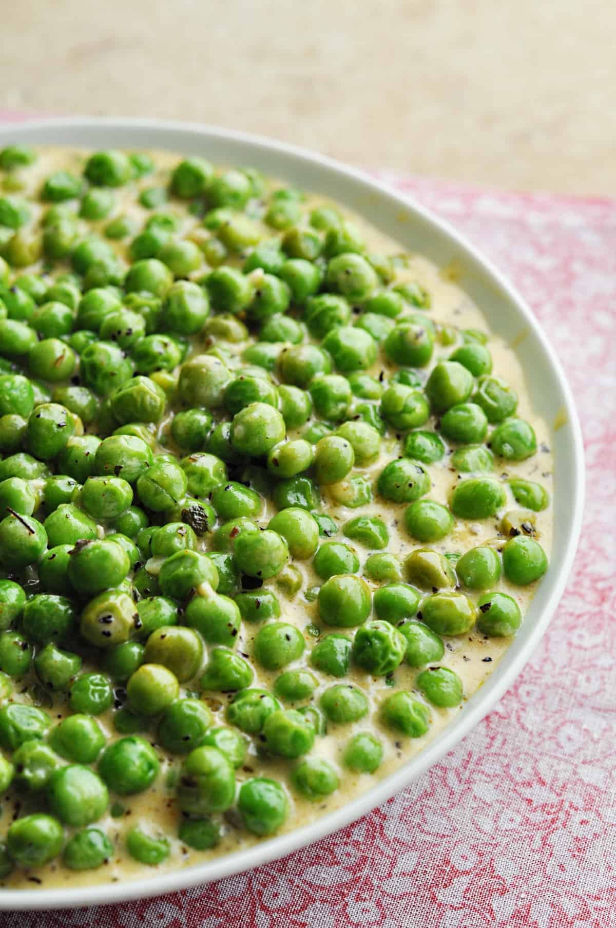 Creamed peas recipe in white bowl