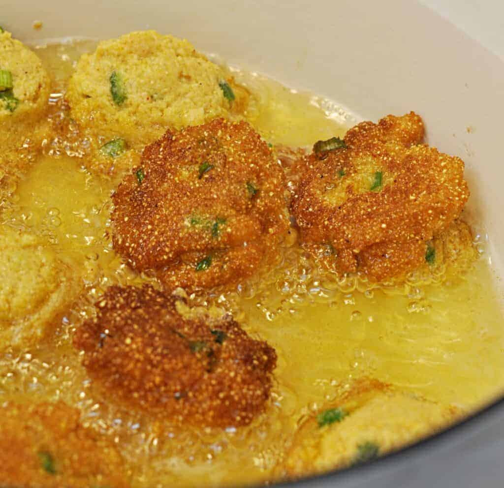 Hush Puppies frying in Dutch oven