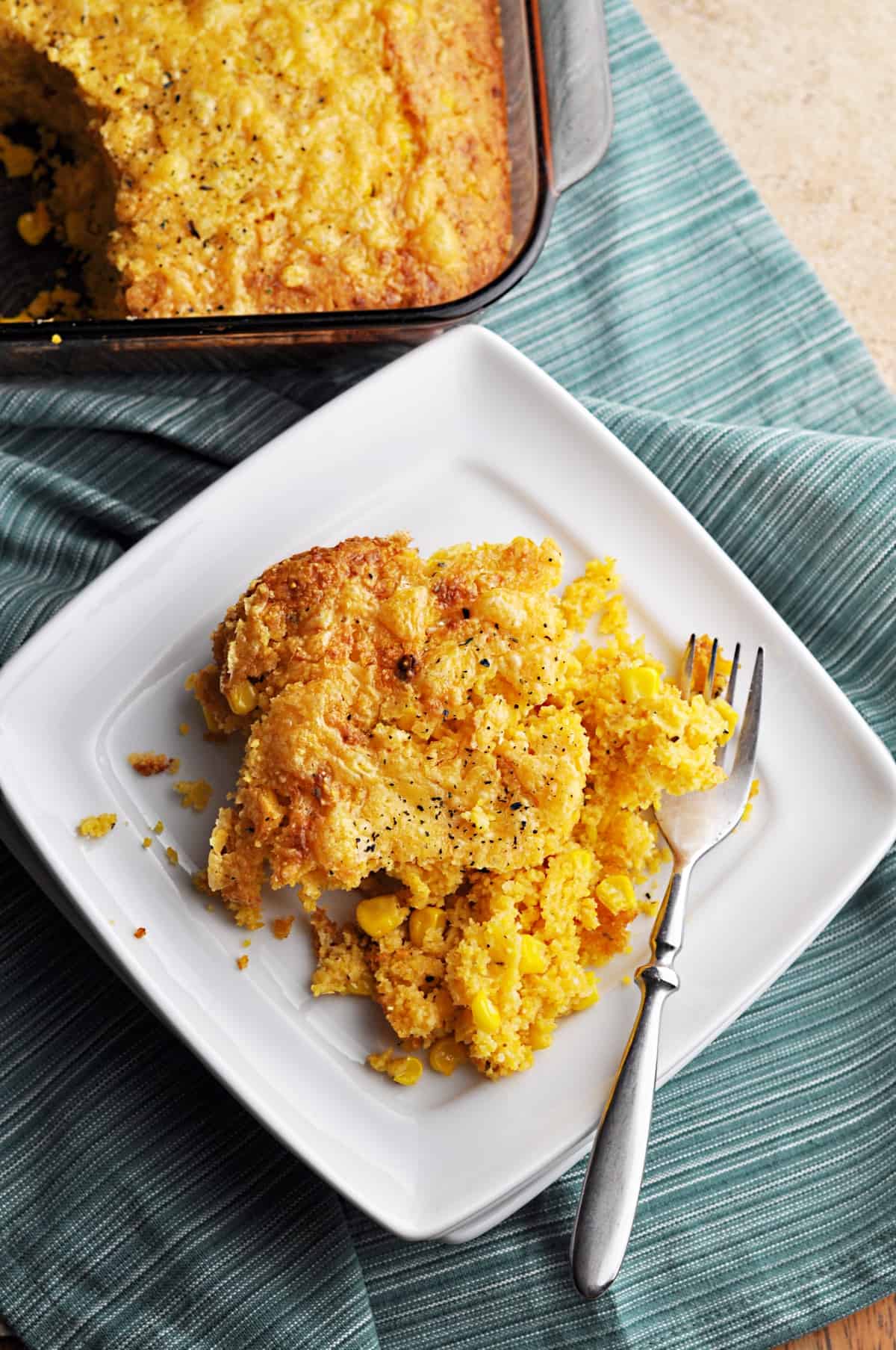 Sweetcorn casserole on white plate with fork