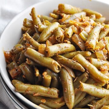 Cajun spiced green beans in bowl ready to eat.