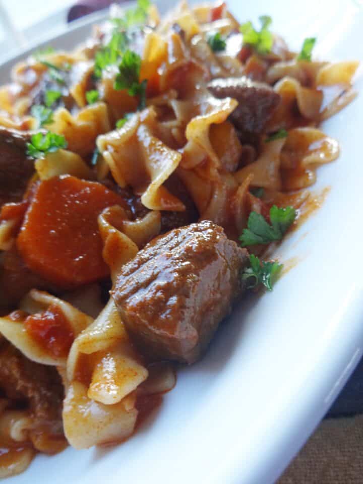 Beef goulash served with noodles