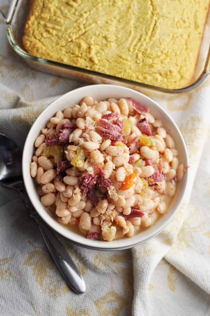 Beans with ham and carrots overhead shot in bowl