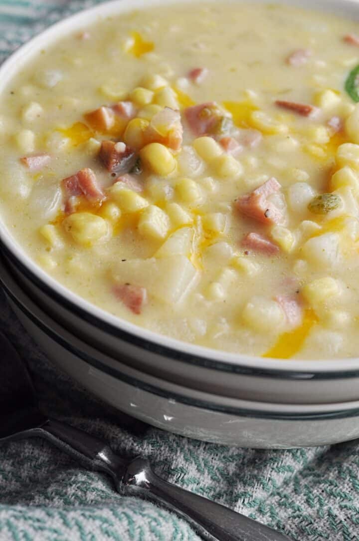 Corn, potato, jalapeno, ham soup closeup in bowl ready to eat