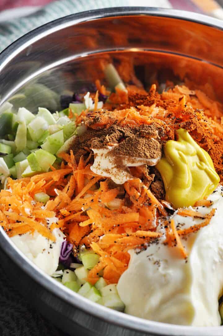 Ingredients in mixing bowl for Apple Cabbage Slaw