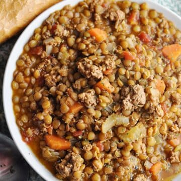 Lentil soup with ground turkey served with bread