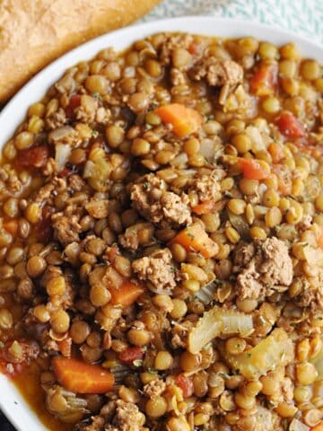 Turkey lentil soup served in a white bowl