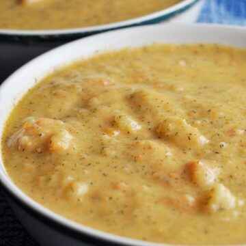 Close up of potato soup in bowl with leeks and carrots