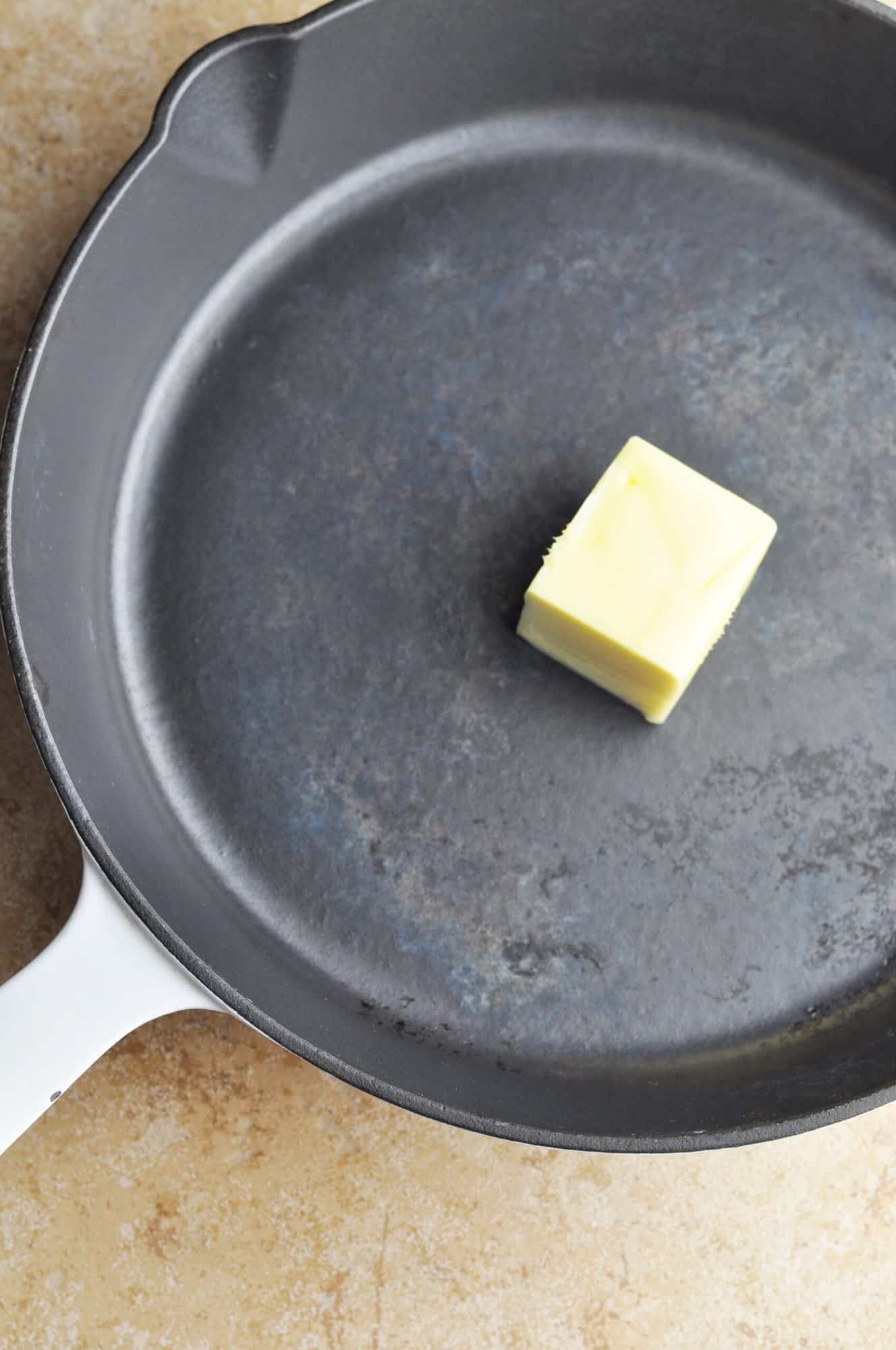 Unmelted butter in cast iron skillet.