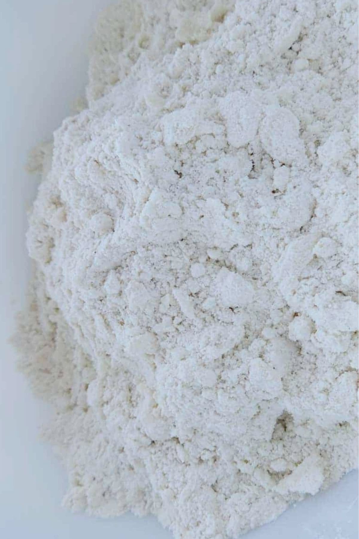Flour, baking powder, salt, and butter mixed up in large bowl.